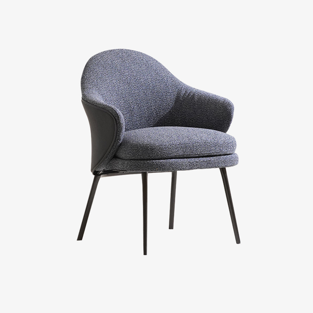 Sillón de comedor con respaldo curvo tapizado en azul contemporáneo