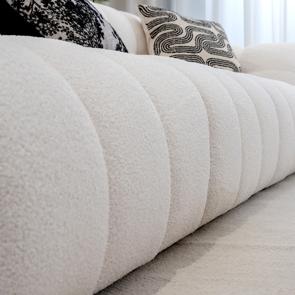 Sof&aacute; de reposabrazos curvo